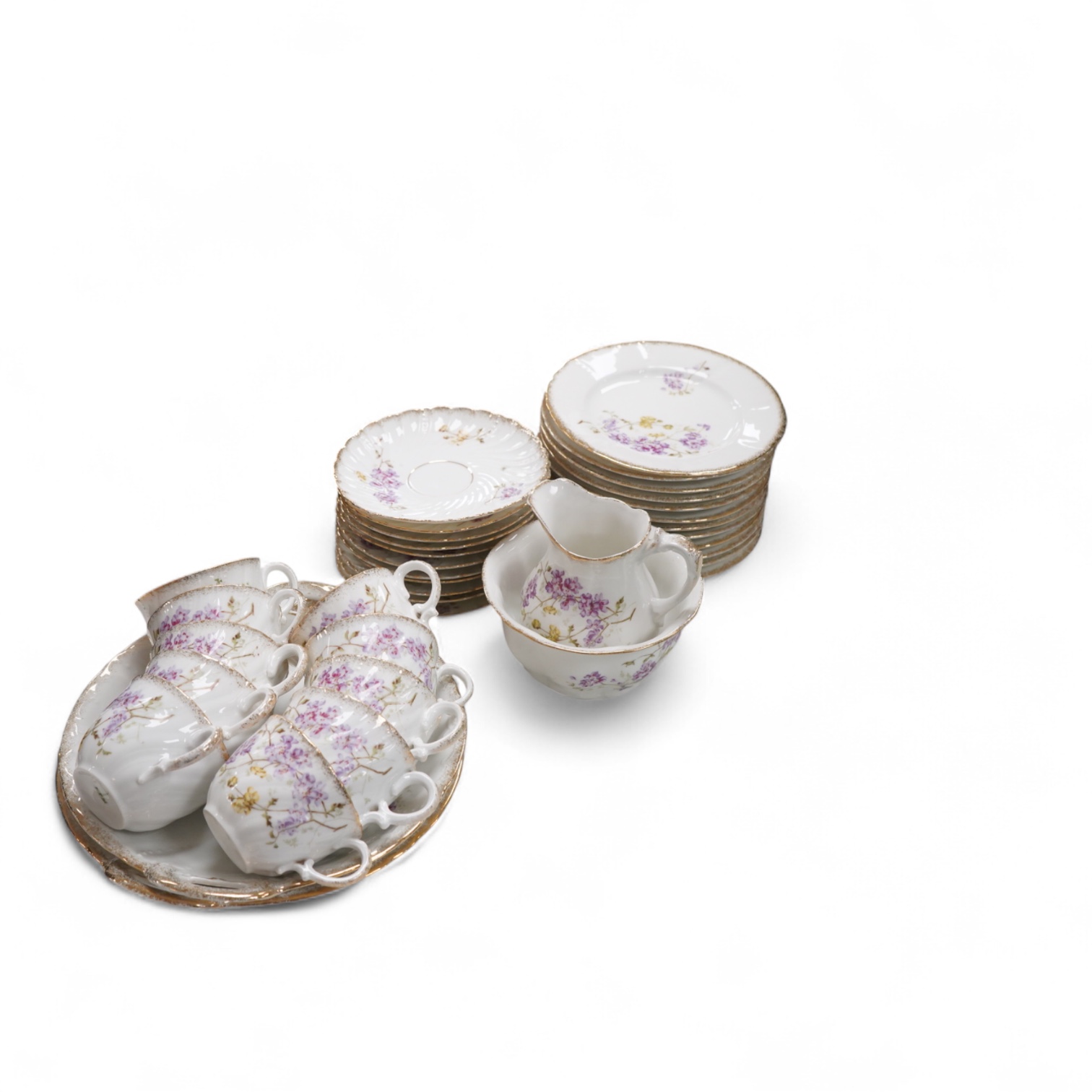A KPM style floral porcelain part tea service, largest 27cm in diameter